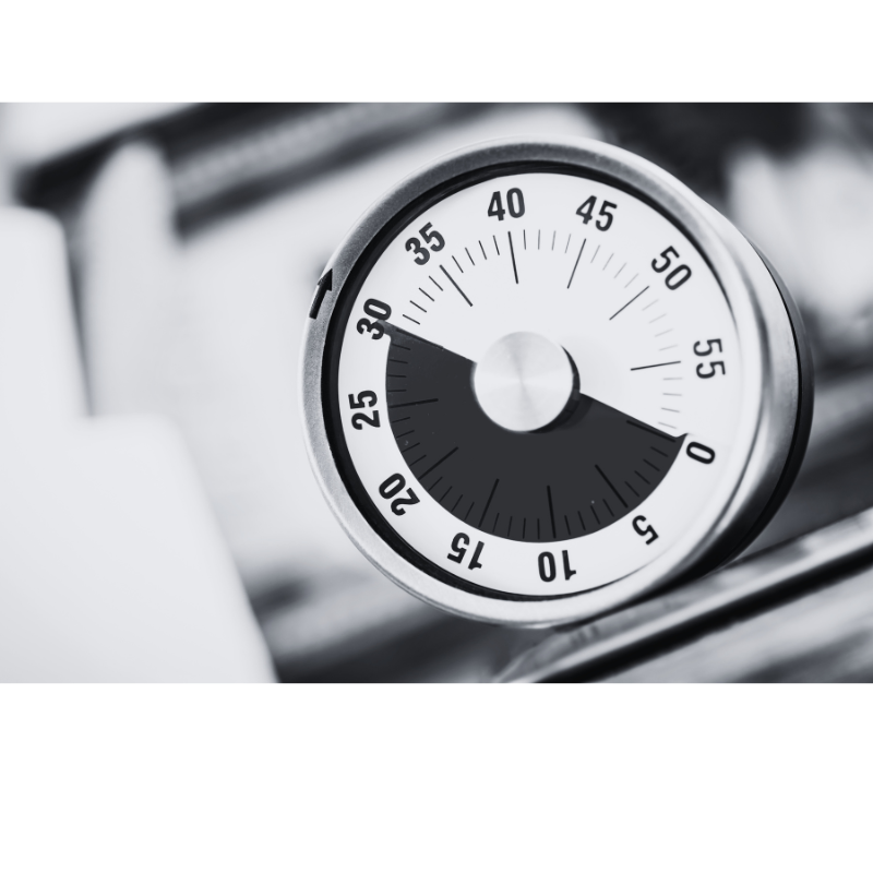 Image of a mechanical timer to help create your first digital product. It is set at 30 minutes